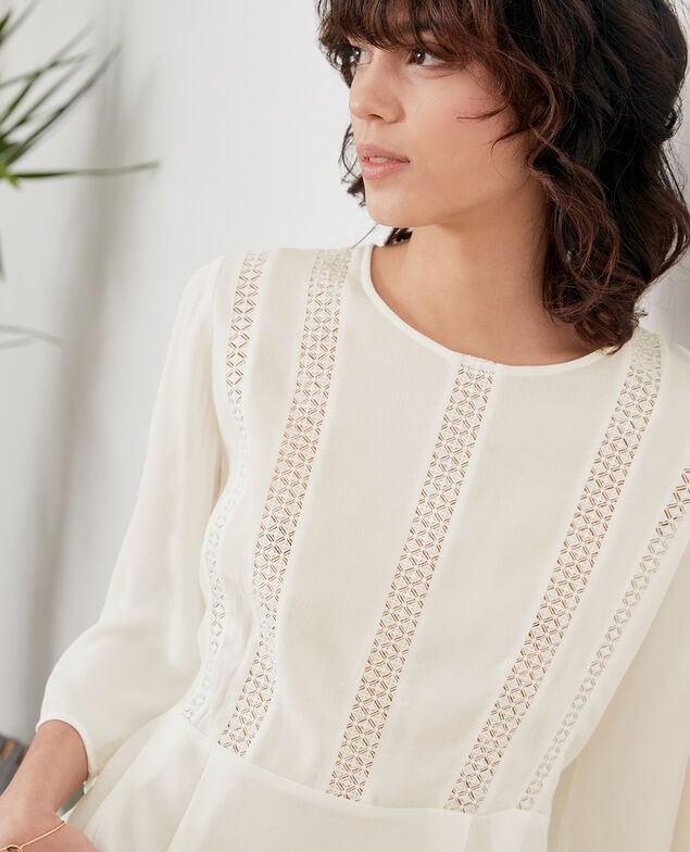Blusa con péplum y encaje Off white